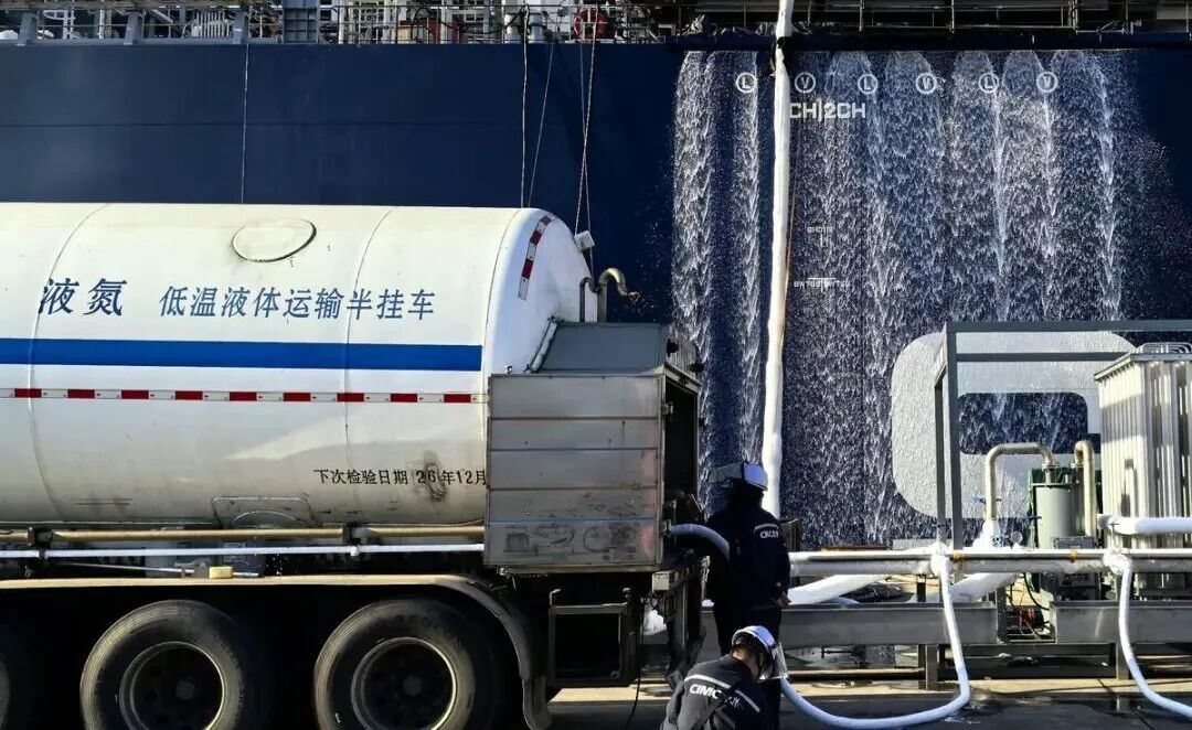 A liquid nitrogen truck cooling the tanks from alongside the vessel.
